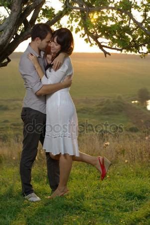 Couple Kissing Under Tree Stock Photo By Xzserg