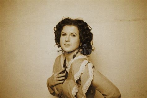 Photo Of Curly Brunette In Retro Style With Sepia Effect Stock Image
