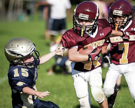 Youth Football Player Running With The Ball Photograph By Jeb Buchman