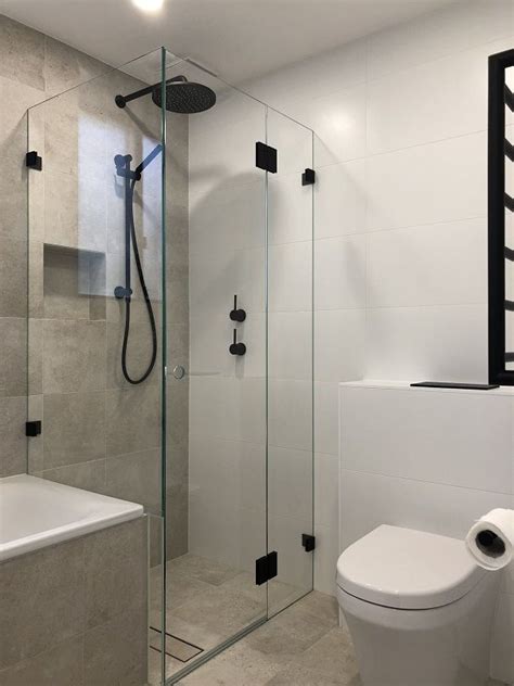 Maybe you would like to learn more about one of these? Frameless hinged shower screen with matte black hinges ...