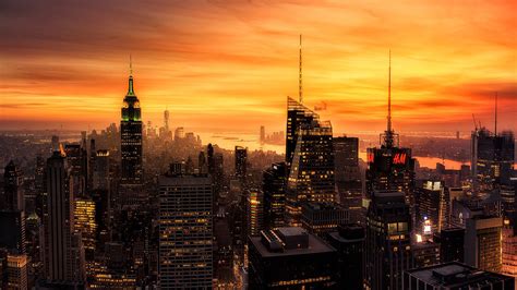 City With High Rising Buildings Under Yellow Sky During Sunset Hd New