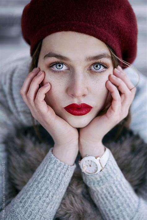 Young Beautiful Woman With Red Hat Blue Eyes And Freckles By Stocksy Contributor Maja