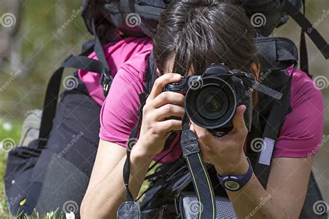 Young Woman Photographer In Action Stock Photo Image Of Range