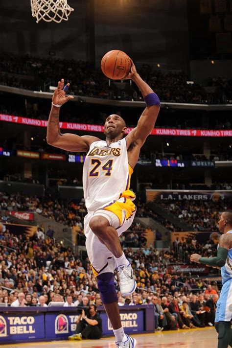 Download Kobe Bryant Captures The Crowd As He Reaches For The Rim