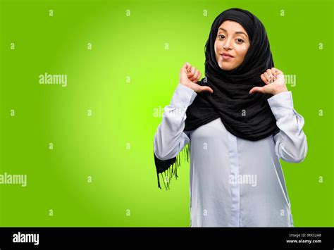 Young Arab Woman Wearing Hijab Proud Excited And Arrogant Pointing
