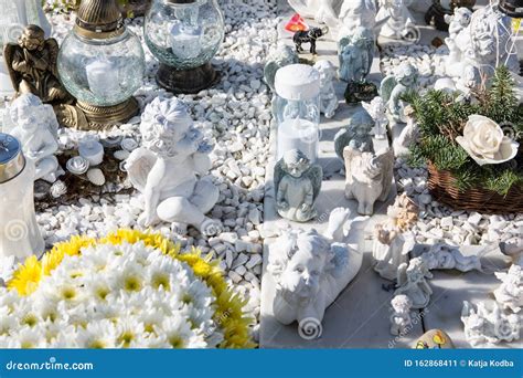 People Remembering Their Loved Ones Who Died; on the Cemetery Stock