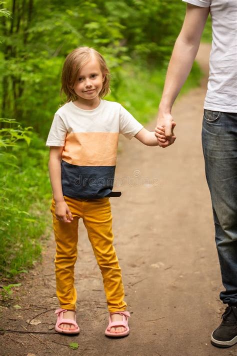 Dad And Daughter Walk In The Forest In Summer The Girl Holds Dadand X27