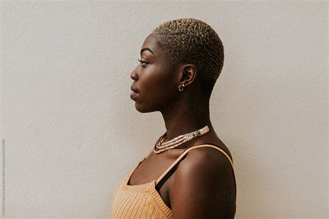 Side Profile Portrait Of A Beautiful Black Woman With A Shaved Head