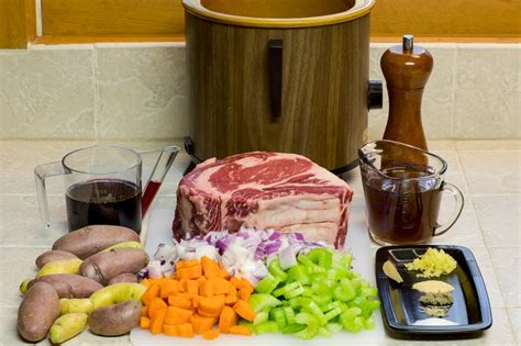 Prime rib or lamb, mashed potatoes, gravy, side of vegetables. How to Cook a Prime Rib Roast in a Crock-Pot With Vegetables | LIVESTRONG.COM