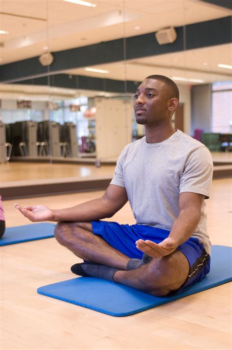 Yoga Free Stock Photo A Man Practicing Yoga In A Fitness Center