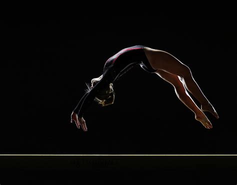 Gymnast Performing Backwards Jump On Photograph By International Rescue