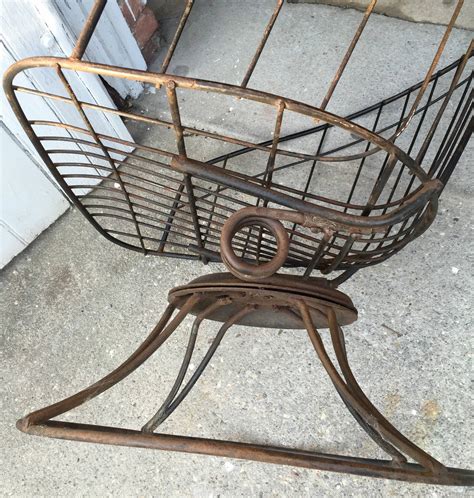 Each leg is tipped with a plastic glide embedded into the metal wire. Homecrest Metal Wire Barrel Chair at 1stdibs