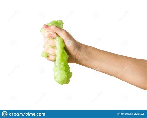 A Green Slime Flows Down In A Large Drop From An Isolated Hand On A