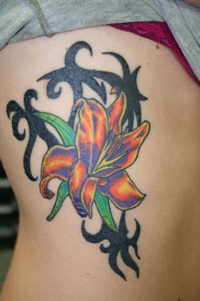 Orange Lily With Tribal Tracery Tattoo Tattooimagesbiz