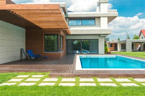 Brown Brick House With Swimming Pool · Free Stock Photo