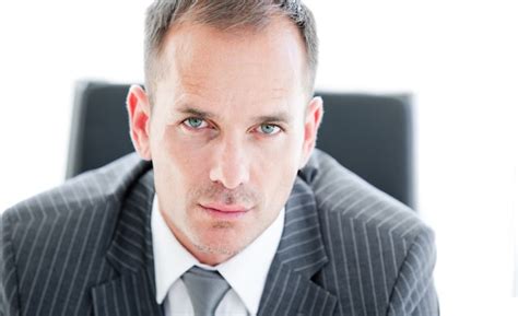 Premium Photo Portrait Of An Attractive Businessman Looking At The Camera