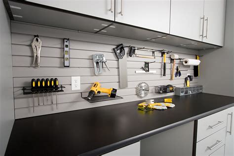 This garage features various storage solutions. Garage Storage Solutions-Garage Organization-Garage ...