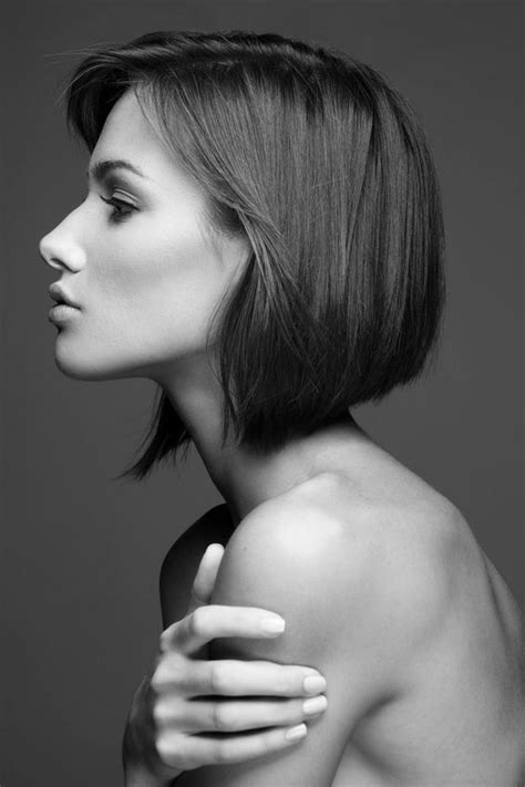 A Black And White Photo Of A Woman With Shoulder Length Bob Haircut