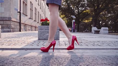 Sexy Woman Legs In Red High Heels Shoes Walking In The City Urban
