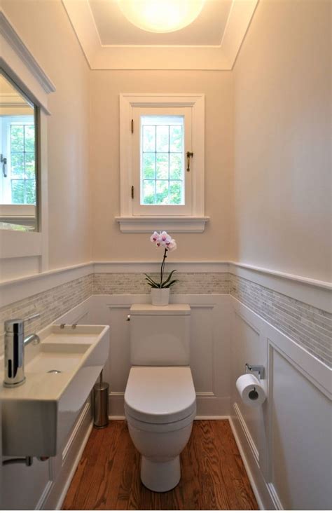 Wall tile is a common choice for bathroom installations, but it may not always agree with your aesthetic or stand up to your bathroom needs. Small bathroom. Good wainscoting with tile detail ...