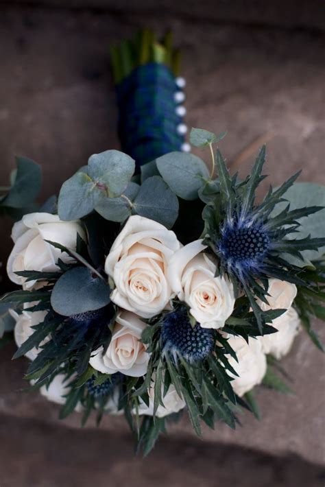 50 beautiful flower meanings that will surprise you. Blue Thistle and white rose bouquet | Flower Arrangements ...