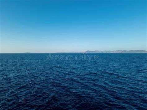 Sea Dark Blue Ripple Water Meets Clear Blue Sky Background Greek