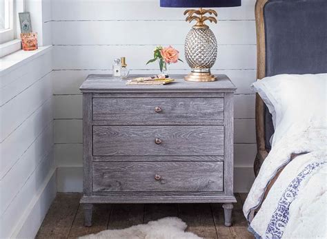 These modern side tables feature a gold/black finished iron frame with a nesting design that allows you to easily move the smaller end table into the other. Bedside Tables | Graham & Green