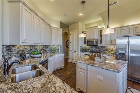 Known for its quality, style, durability and comfort; Gehan Homes Kitchen - White Cabinets, Marble Granite ...