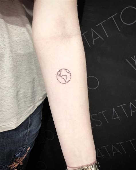 fine line planet earth tattoo on the left inner forearm tatuajes ocultos tatuajes de arte de