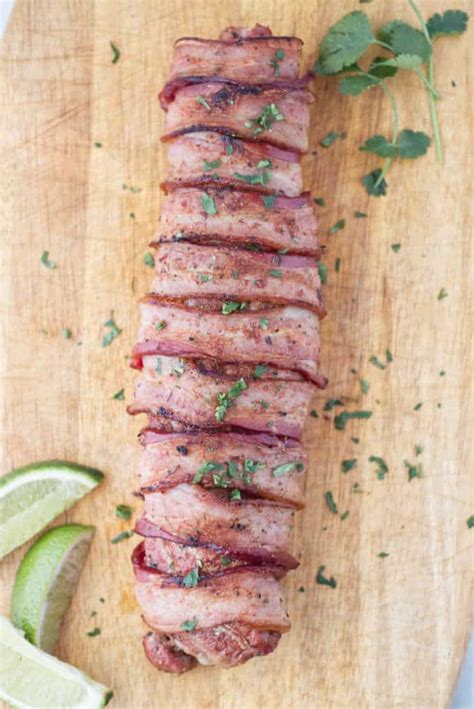 Bacon wrapped pork tenderloin is an all in one meal. Traeger Bacon-Wrapped Pork Tenderloin | A License To Grill