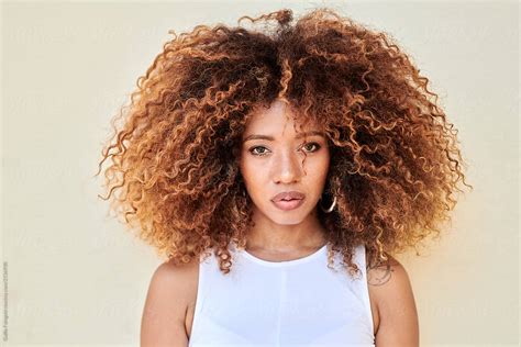 Portrait Of Beautiful Girl With Frizzy Hair By Stocksy Contributor