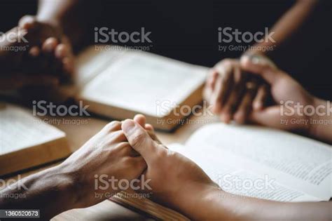 Christian Group Of People Holding Hands Praying Worship To Believe And