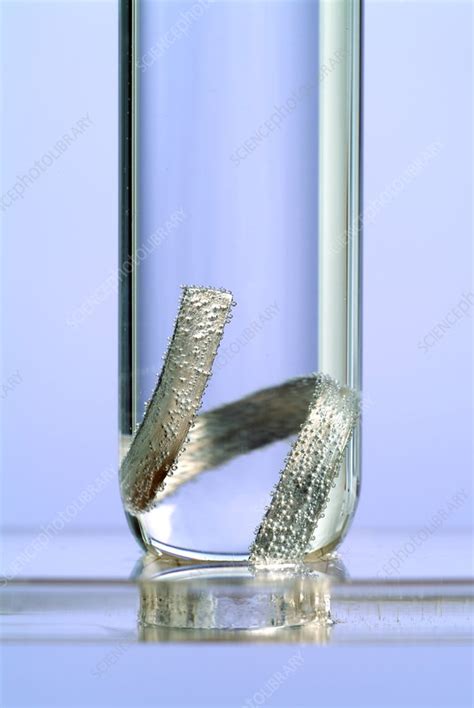 Magnesuim would react with the water in the pipes to produce magnesium hydroxide. Magnesium reacting in water - Stock Image - A500/0627 ...