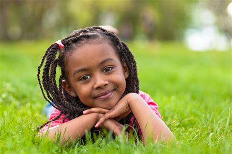 Outdoor Portrait Of A Cute Young Black Girl Smiling African Pe