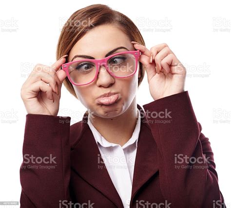 Woman Wearing Nerd Glasses And Making Funny Faces Stock Photo