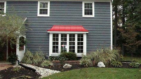 They are designed to protect a home through decades of weathering with minimal upkeep, and are available in hundreds of colors and styles. Red Metal Roof & dark gray shingles | House Exterior ...