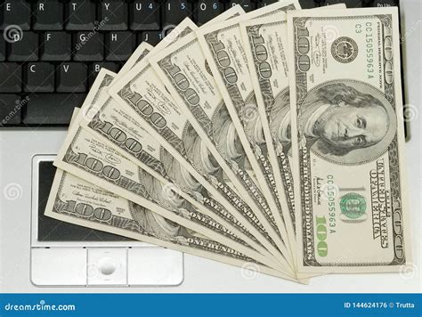 Hundred Dollar Bills Lying On Laptop Stock Photo Image Of Banknotes