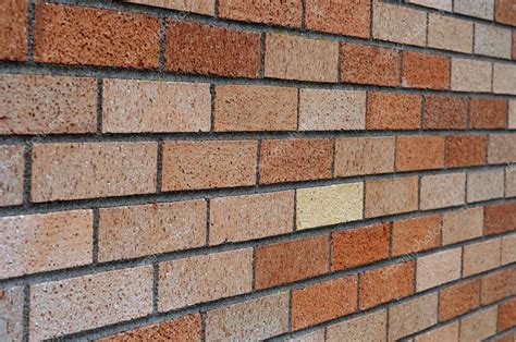 Maybe who ever constructed this roof tried making some kind of artistic architectural statement. Angled brick wall — Stock Photo © vlue #4631058