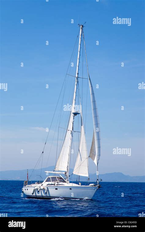 Blue Mediterranean Sailboat Sailing In Perfect Ocean Stock Photo Alamy
