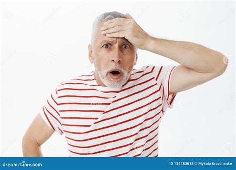 Portrait Of Shocked Speechless Concerned Old Man Punching Forehead With