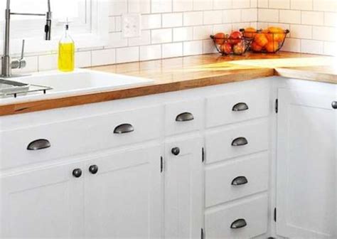 With a stained cabinet finish, it's nice to create some contrast with the hardware by using a white glass knob. DIY Kitchen Cabinets - Simple Ways to Reinvent the Kitchen ...