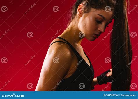Profile Photo Of A Brunette Girl With Long Hair Dripping With Sweat After An Intense Workout