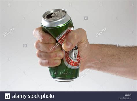 But you can learn how to take control back. Symbol photo, a beer can is crushed by hand Stock Photo ...