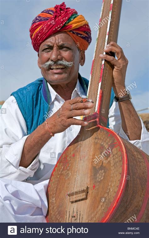 Indian Man Playing The Tanpura Khuri Village Rajasthan India Stock