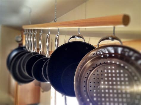 Premier reversible arch hanging pot rack this modern styled, slightly curved pot rack features three racks and will provide an extra storage space for bigger pots. How To Choose The Right Rack For Hanging Pots and Pans