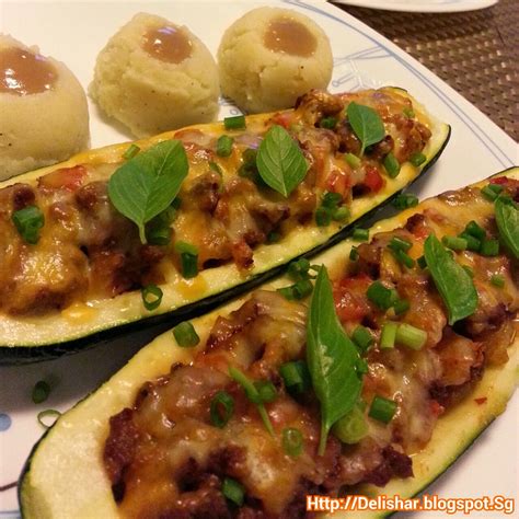 Mix in the beans, corn and spices, add the salsa and shredded cheese. Beef Stuffed Zucchini Boats - YourAmazingPlaces.com