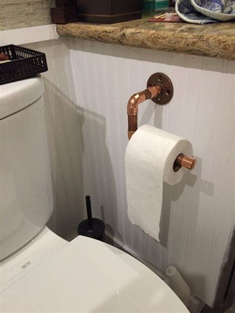 1 aligning the toilet paper holder on the wall. Copper Toilet paper holder | Toilet paper, Toilet paper ...