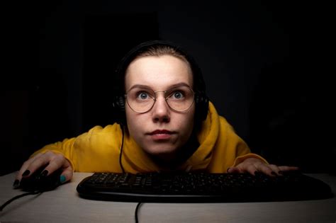 Premium Photo Girl Gamer Playing A Video Game On A Computer At Night