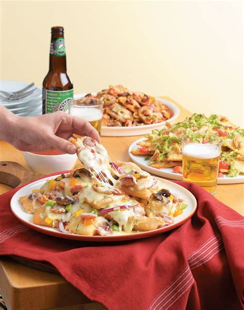 Avoid soggy nachos by briefly baking them before topping with cheese, seasoned beef, refried beans, guacamole, and salsa. Pizza Nachos Recipe
