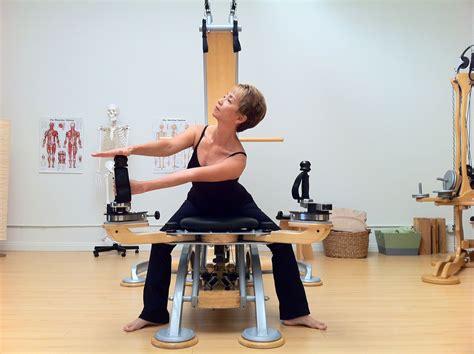 Ryoko Gibson Demonstrating The Gyrotonic Pulley Tower Combination Unit